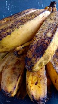 A banana with a close-up, against a black background, A banana f