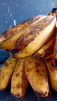 A banana with a close-up, against a black background, A banana f
