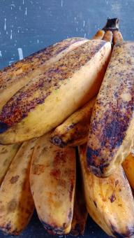 A banana with a close-up, against a black background, A banana f