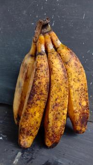 A banana with a close-up, against a black background, A banana f