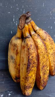 A banana with a close-up, against a black background, A banana f