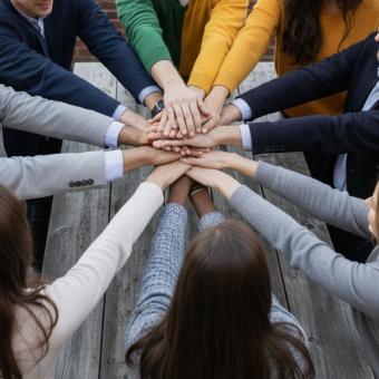 Teamwork and collaboration with hands together symbolizing unity, succ