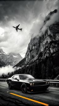 Powerful Car Soars with Jet Above Majestic Mountains under Cloudy Skie